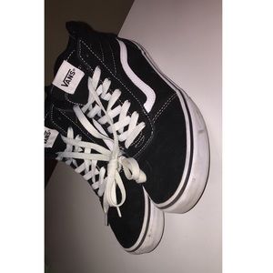 Black and white high top Vans
